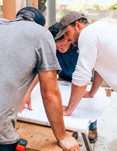 3 men working hard on a commercial renovation construction project in Santa Rosa Beach, Florida